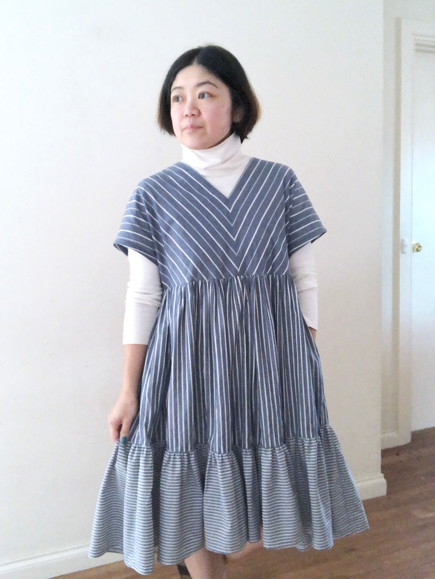 KOTONE Organic Cotton Tiered Dress layered with a Comfort Turtle